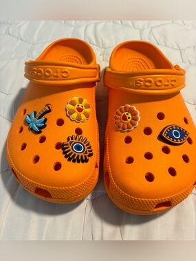 CROCS J5 in Bright Orange with Playful Charms